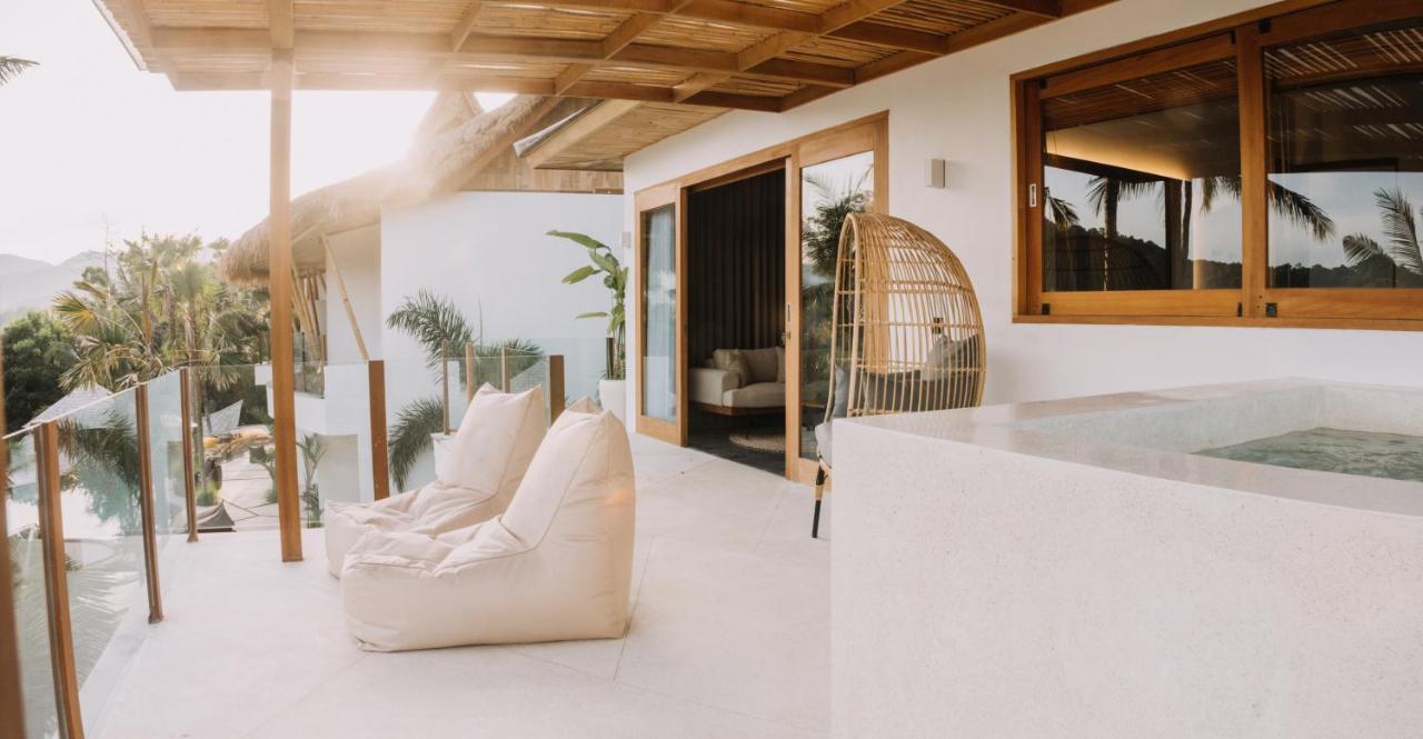 Neano Escape Hotel Manggis  ภายนอก รูปภาพ The interior of a villa at the resort